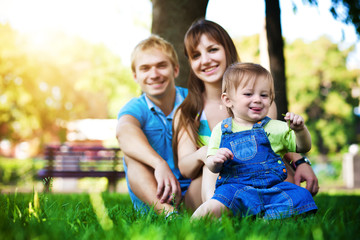 happy family resting in the summer park. picnic