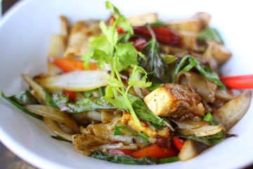 Thai entrée with tofu and pan fried wide rice noodles.