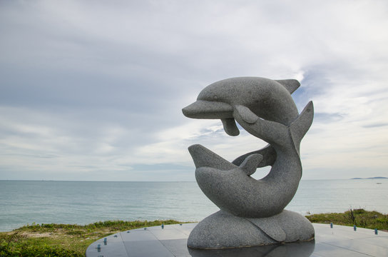 Dolphin sculpture in thai beach