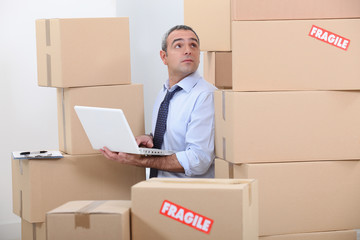 Man surrounded by cardboards