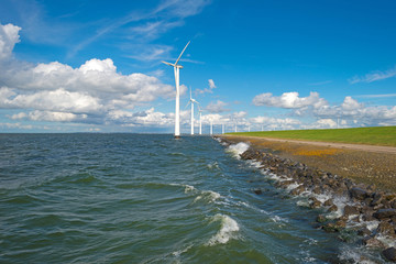 Wind farm in a stormy lake