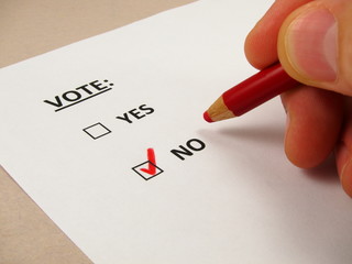 Voting  'no' with a red pencil