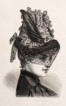 Fototapeta young woman wearing an elegant hat. engraved illustration 1885