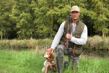 A hunter and his dog.