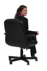 Business professional sitting in a swivel chair