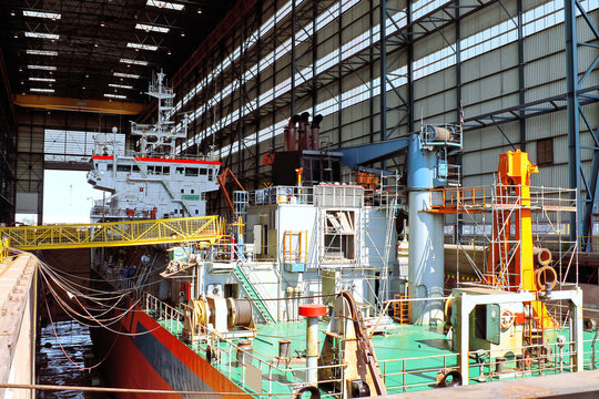 Ship in shipyard's covered dry dock