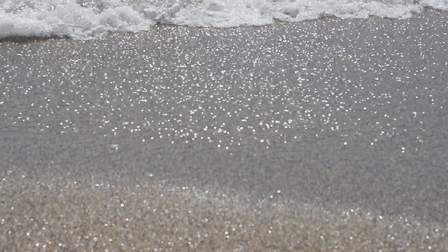 Running sea waves on the shore