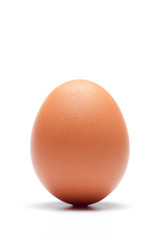 Chicken egg over a white background