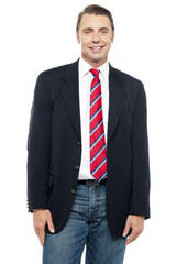 Smiling young businessperson posing casually