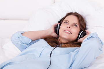 Woman relaxing listening to music