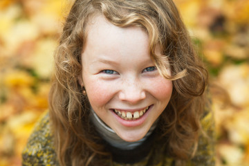 Outdoor high angle portrait of smiling blond girl