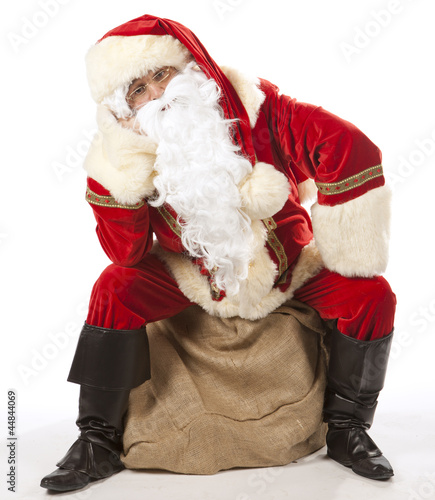 "Père Noël assis sur sa hotte" photo libre de droits sur la banque d'images Fotolia.com - Image 