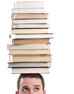 Man with books on his head