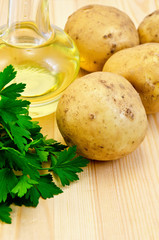 Potatoes yellow with parsley and oil