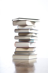 books piled on table