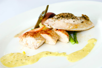 Grilled chicken breast with vegetables and cream sauce