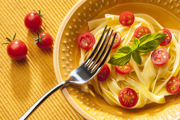 Dish with noodles  tomato and basil