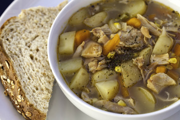 Simple home made chicken soup with oatmeal bread