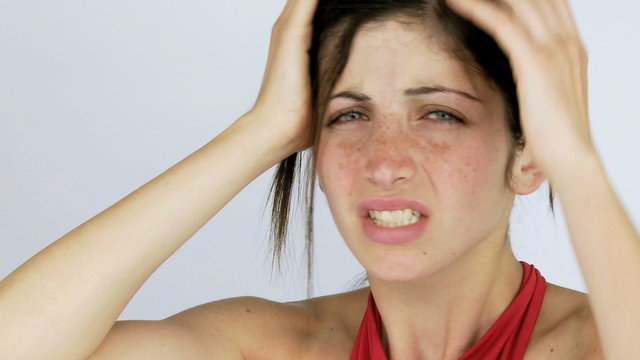 Woman suffering terrible headache