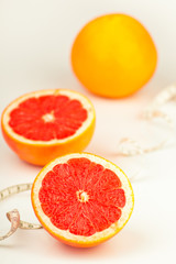 Fototapeta na wymiar Measure tape and healthy grapefruit