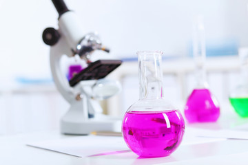 Chemistry laboratory glassware with colour liquids