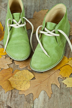 Green Leather Boots And Yellow Leaves