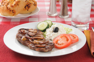 Steak with sauteed mushrooms and onions