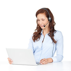 lächelnde frau mit laptop und headset