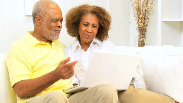 Senior African American Couple Home Wireless Laptop