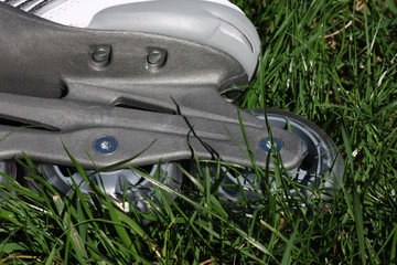 close up of wheel of skate in grass