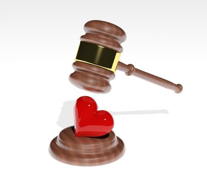 Gavel coming down on a 3d heart design