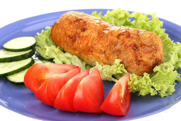 Tasty meat cutlet with garnish on plate close-up