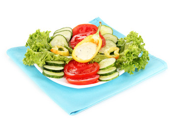 Chopped vegetables and sauce on plate isolated on white