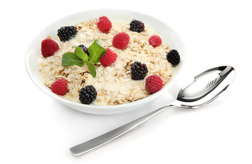 tasty oatmeal with berries, isolated on white