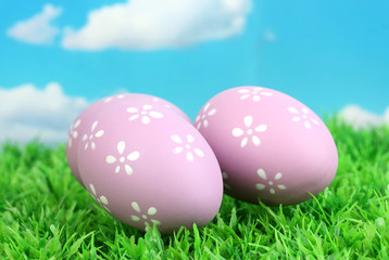 Colorful easter eggs on grass