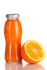Delicious orange juice in a bottle and orange next to it