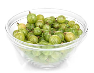 Green gooseberry in glass bowl isolated on white