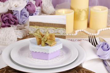 Serving fabulous wedding table in purple and gold color