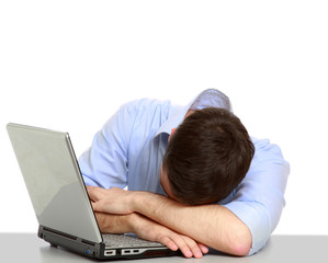 young business man sleeping on the laptop