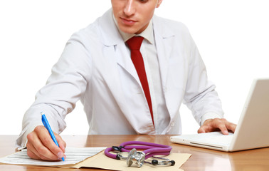 A male doctor working at desk