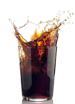 splash of cola with ice cubes