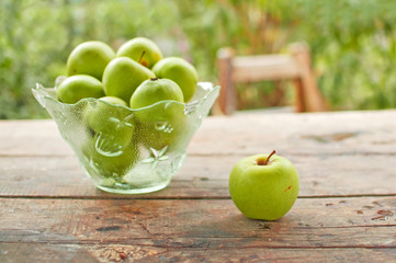 Green apples on table