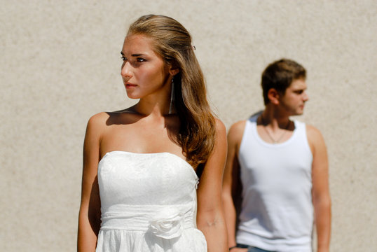 Young Couple Looking In Opposite Directions