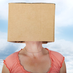 Woman has box with painted face on the head