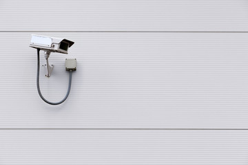 CCTV camera on wall with copy space - Powered by Adobe