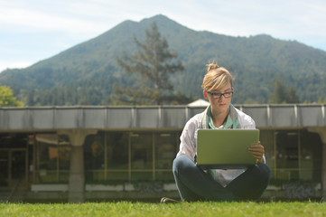 Young beautiful female student on campus