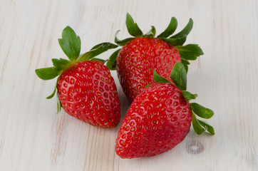 Three fresh strawberries