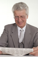 An businessman in glasses sitting