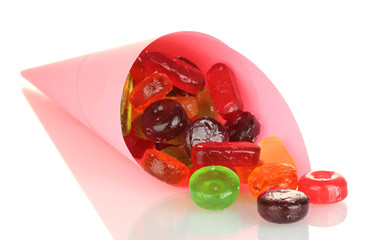 Tasty colorful candies in bright bag isolated on white