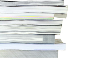 Stack of books on white background, partial view.